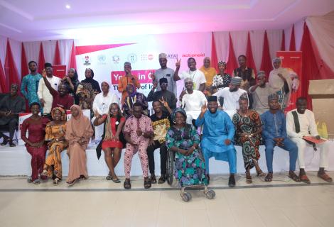 Group of young people standing together for a photograph, representing youth participation and collective voices in the 2024 Humanitarian Response Plan Youth Lens Report Card.