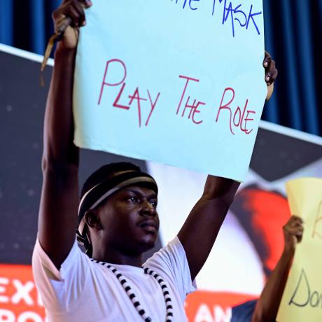 SOmeone holding up a placard with a message