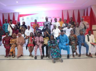 Group of young people standing together for a photograph, representing youth participation and collective voices in the 2024 Humanitarian Response Plan Youth Lens Report Card.